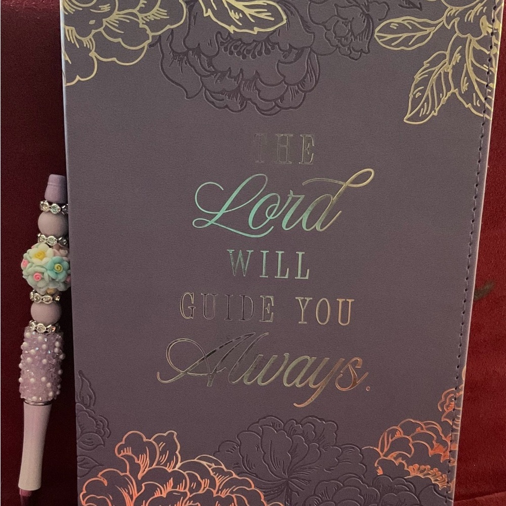 Floral Embossed Purple Journal with Hand Crafted Pen. Journal is 8.5 x 5.75”